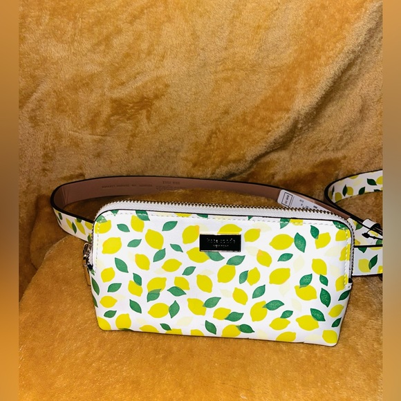 kate spade Handbags - Kate Spade Lemon Print Wristlet in White and Yellow